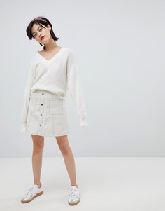 Мини-юбка из искусственной кожи с карманами River Island - Кремовый