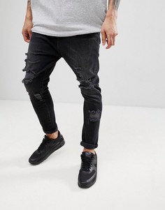 Выбеленные черные рваные джинсы заниженного кроя ASOS DESIGN - Черный