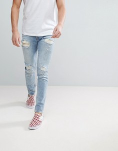 Светло-синие джинсы скинни с рваной отделкой ASOS - Синий