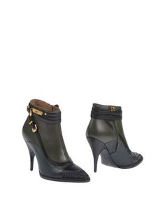 Полусапоги и высокие ботинки Moschino