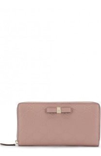 Кожаное портмоне с тиснением Signature на молнии Gucci