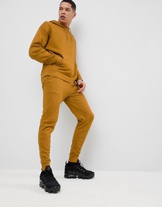 Темно-желтый спортивный костюм свободного кроя ASOS DESIGN - Желтый