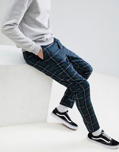 Суженные книзу брюки с принтом тартан ASOS DESIGN - Темно-синий