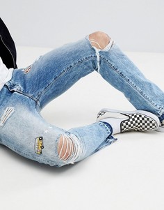 Суженные книзу джинсы с нашивкой в винтажном стиле Wrangler - Синий