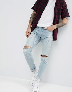 Светлые джинсы скинни с рваной отделкой Hollister - Синий
