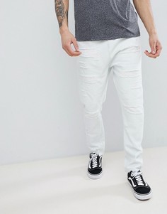 Выбеленные джинсы заниженного кроя с рваной отделкой ASOS DESIGN - Синий