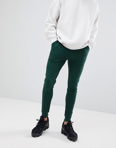 Зеленые супероблегающие джоггеры ASOS DESIGN - Зеленый