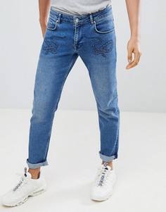 Синие выбеленные джинсы слим с принтом змей ASOS DESIGN - Синий