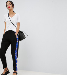 Суженные книзу брюки с полосой по бокам ASOS DESIGN TALL - Черный