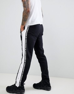 Джоггеры узкого кроя с отделкой лентой и кнопками ASOS DESIGN - Черный
