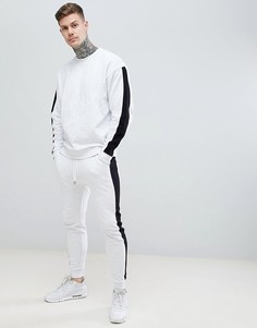 Белый меланжевый спортивный костюм из oversize-свитшота и облегающих джоггеров с черными полосами по бокам ASOS DESIGN - Белый