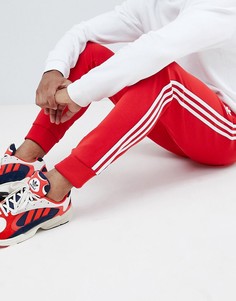 Красные облегающие джоггеры с тремя полосками adidas Originals DH5837 - Красный