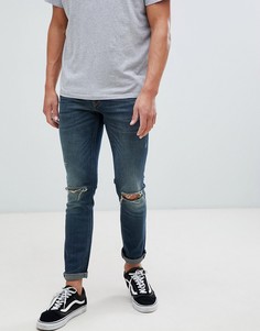 Синие джинсы скинни с рваной отделкой River Island - Синий