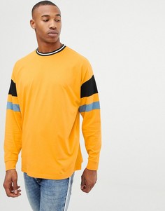 Желтый удлиненный oversize-лонгслив в стиле колор блок ASOS DESIGN - Желтый