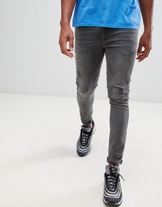 Черные супероблегающие джинсы с потертостями ASOS DESIGN - Черный