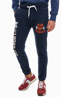 Синие хлопковые брюки джоггеры с принтом Superdry
