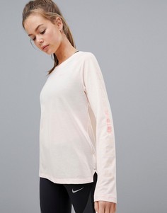 Розовый лонгслив Nike Running Tailwind - Розовый