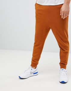 Джоггеры цвета ржавчины с заниженной проймой ASOS DESIGN - Коричневый