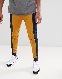 Зауженные джоггеры колор блок ASOS DESIGN - Темно-синий