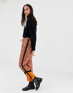 Брюки с цветочным принтом и контрастными вставками Maison Scotch - Оранжевый