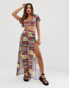 Трикотажные пляжные брюки с тропическим принтом и разрезами спереди ASOS DESIGN - Мульти