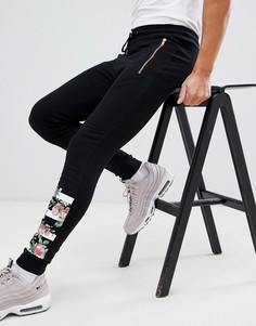 Джоггеры скинни с карманами на молнии и цветочным принтом ASOS DESIGN - Черный