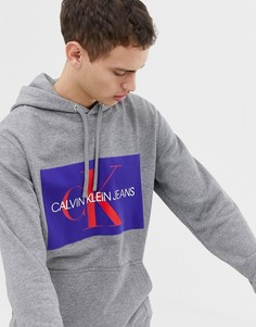 Худи серого цвета с логотипом и отделкой флок Calvin Klein Jeans - Серый