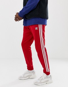 Красные джоггеры скинни с 3 полосками и манжетами adidas Originals DV1534 - Красный
