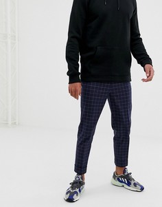 Темно-синие суженные книзу брюки в клетку ASOS DESIGN - Темно-синий