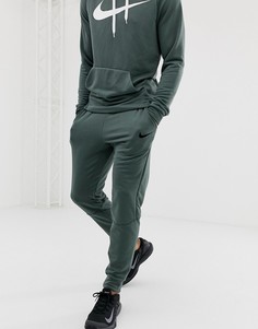 Зеленые суженные книзу брюки Nike Training - Зеленый