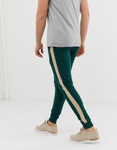 Темно-зеленые супероблегающие джоггеры с полосками по бокам ASOS DESIGN - Зеленый