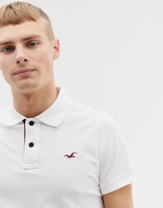 Поло из пике белого цвета обтягивающего кроя с логотипом Hollister - Белый