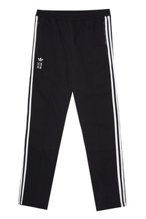 Спортивные брюки с лампасами и логотипами Adidas