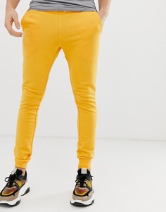 Желтые супероблегающие джоггеры ASOS DESIGN - Желтый