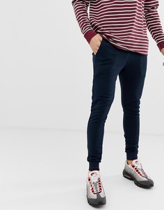 Темно-синие супероблегающие джоггеры ASOS DESIGN - Темно-синий