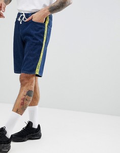 Темно-синие джинсовые шорты свободного кроя с полосками ASOS DESIGN - Синий