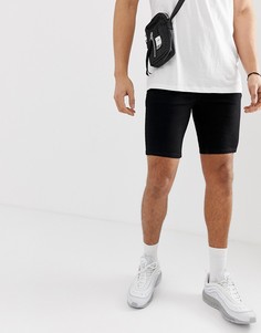 Черные эластичные джинсовые шорты с напылением ASOS DESIGN - Черный