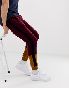 Красные бархатные джоггеры скинни колор блок ASOS DESIGN - Зеленый