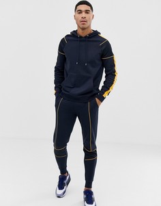 Темно-синий спортивный костюм с кантом и сетчатыми вставками ASOS DESIGN - Темно-синий