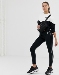 Черно-белые леггинсы с боковыми вставками Nike - Черный