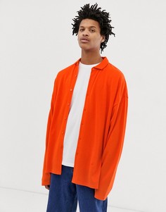 Oversize-поло из пике оранжевого цвета на пуговицах ASOS DESIGN - Оранжевый