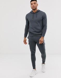 Выбеленный черный спортивный костюм с джоггерами скинни ASOS DESIGN - Черный