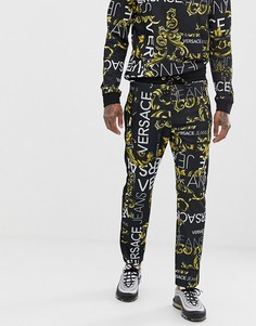 Черные джоггеры скинни со сплошным принтом логотипа Versace Jeans - Черный