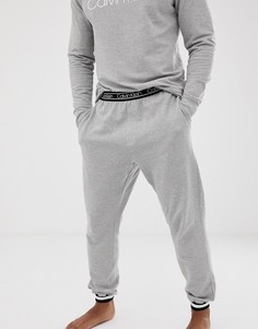 Серые джоггеры с логотипом на поясе и манжетами Calvin Klein Modern FLX - Серый