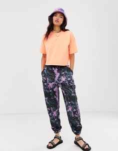 Свободные джоггеры с принтом тай-дай ASOS DESIGN - Мульти