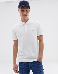 Поло белого цвета с однотонным логотипом Lacoste - Белый