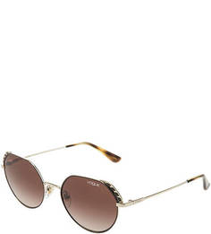 Солнцезащитные очки в золотистой металлической оправе Vogue