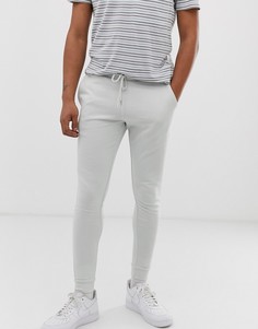 Светло-серые джоггеры скинни ASOS DESIGN - Серый