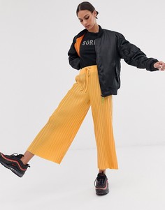 Оранжевые брюки с широкими штанинами Bershka - Оранжевый
