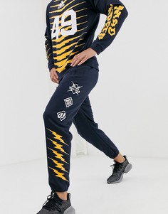 Темно-синие брюки с принтом adidas GRFX - Темно-синий